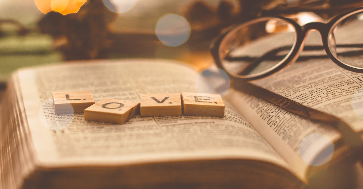 Love scrabble pieces on a Bible, Loving God with all of your heart