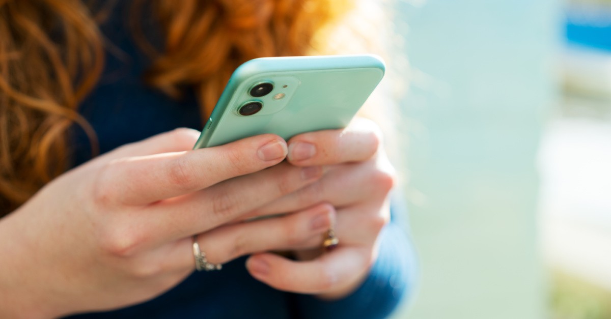 woman holding a phone