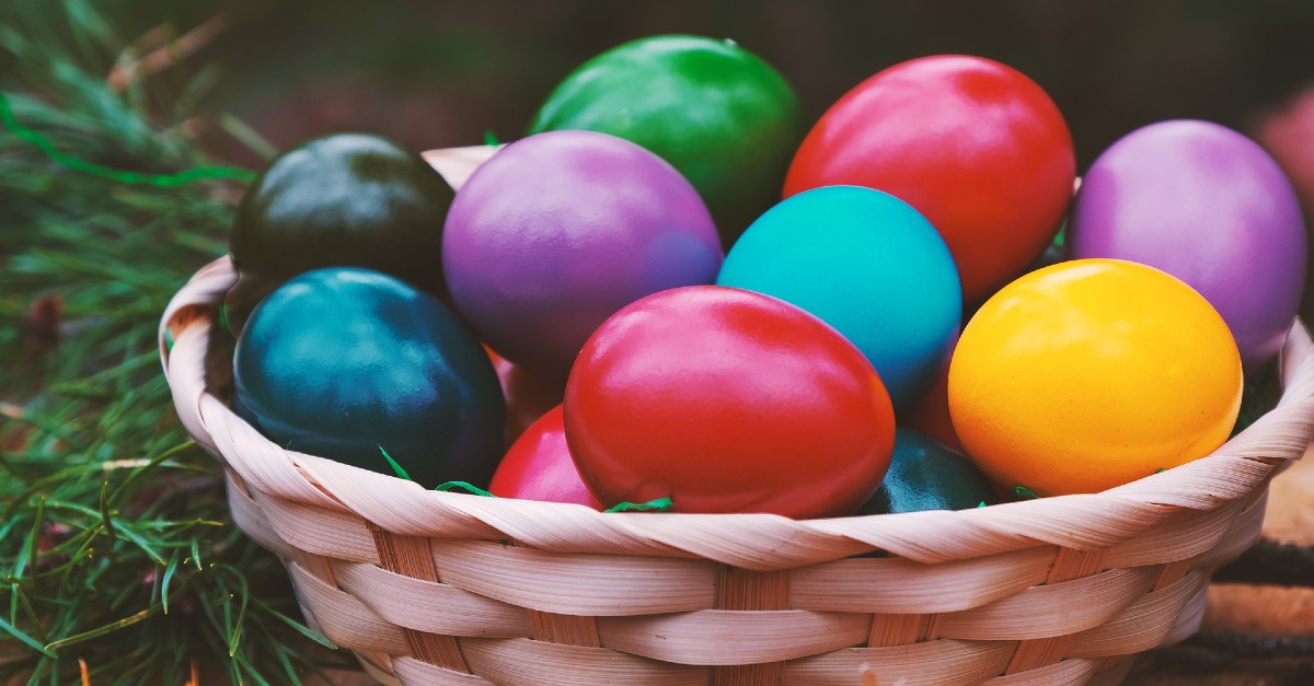 Basket of Easter eggs; nonbelievers questions what common Easter traditions are Christian.